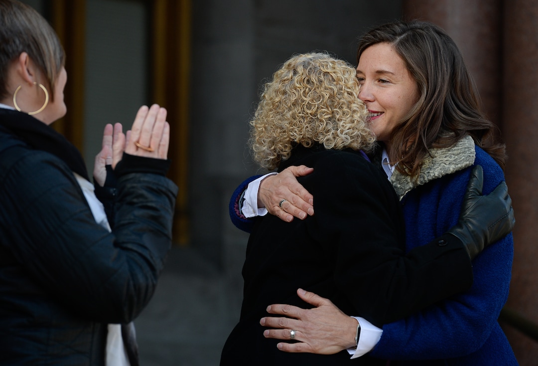 (Francisco Kjolseth  |  The Salt Lake Tribune) Outgoing Mayor Jackie Biskupski, center, embraced newly sworn in Mayor Erin Mendenhall during inauguration ceremonies at Salt Lake City Hall on Monday, Jan. 6, 2020.
