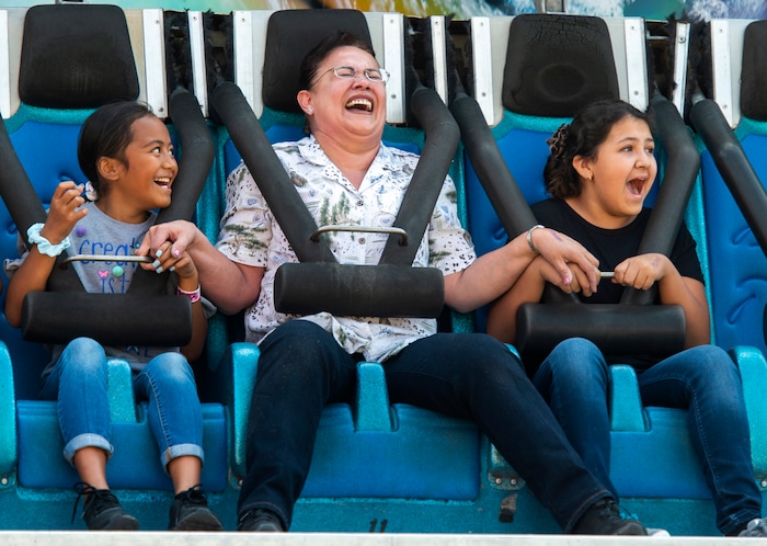 (Rick Egan  |  The Salt Lake Tribune)    
Bet Iloa, Jessie Baray, and Tania Aguirre ride the Moby Dick ride, at the Utah State Fair Monday, Sept. 9, 2019.