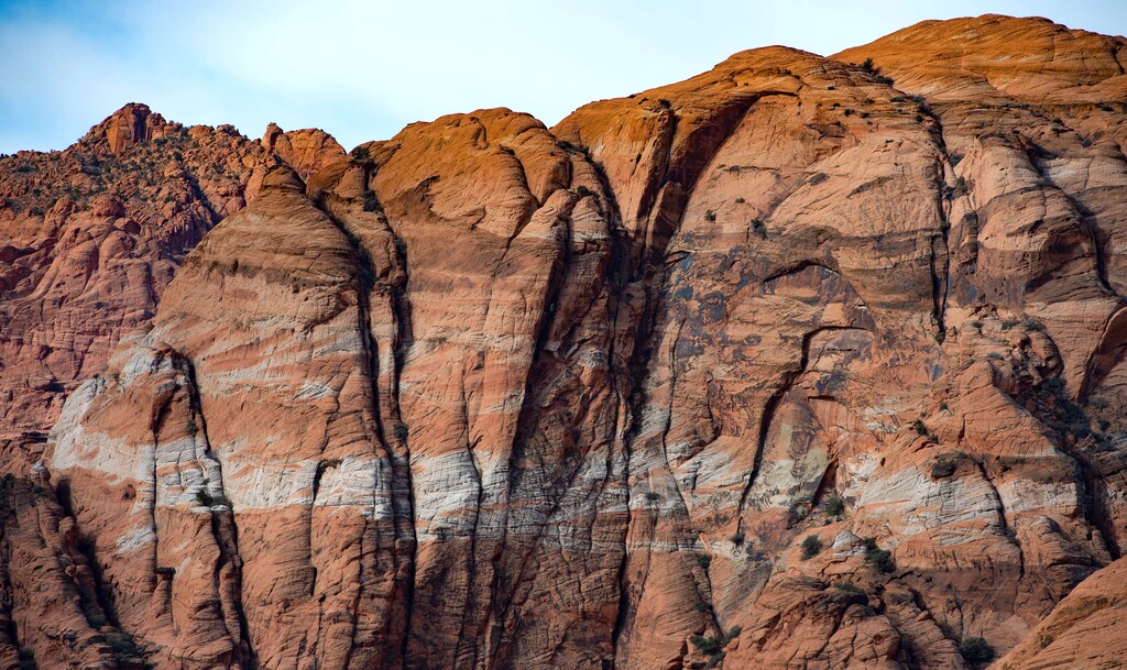 (Francisco Kjolseth  | The Salt Lake Tribune) Bright banding graces the sandstone cliffs of Snow Canyon State Park, a scenic park surrounded by ancient lava flows in Utah’s southern desert. 