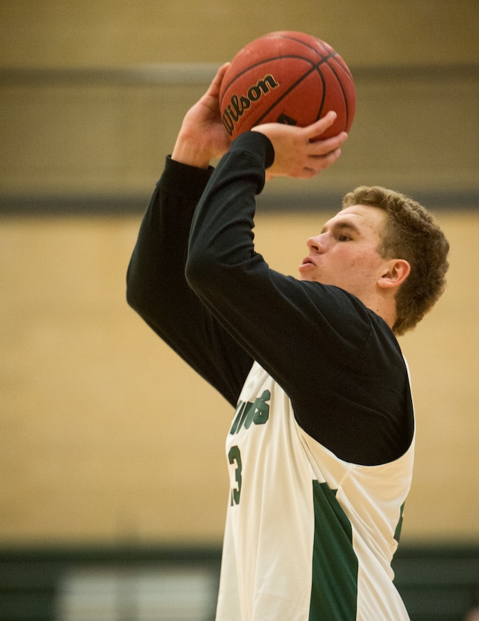 (Rick Egan  |  The Salt Lake Tribune)    Harrison Creer (23), one of Olympus boys' basketball team's two big men, runs drills during practice, Monday, January 8, 2018.