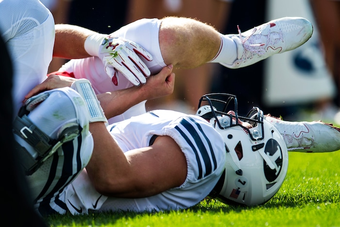 (Chris Detrick  |  The Salt Lake Tribune)  Brigham Young Cougars quarterback Beau Hoge (7) is chased down for a safety by Wisconsin Badgers linebacker Tyler Johnson (59) during the game at LaVell Edwards Stadium Saturday Saturday, September 16, 2017. Wisconsin Badgers defeated Brigham Young Cougars 40-6.