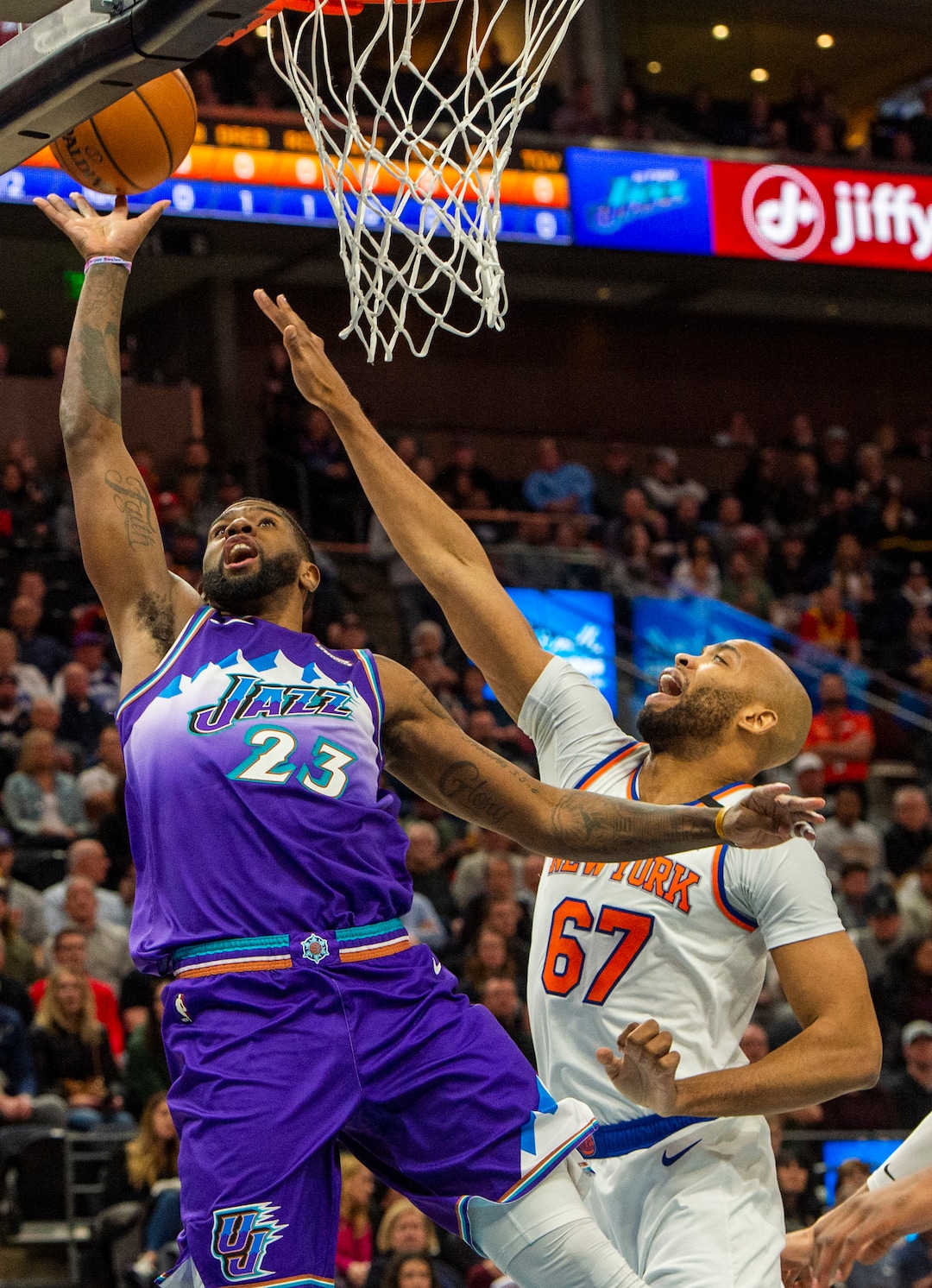 (Rick Egan  |  The Salt Lake Tribune) Utah Jazz forward Royce O'Neale (23) scores as New York Knicks forward Taj Gibson (67)  defends, in NBA action between the Utah Jazz and the New York Knicks, in Salt Lake City, Wednesday, Jan. 8, 2020.