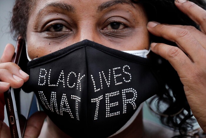 Mourners stand outside Ebenezer Baptist Church during the funeral for Rep. John Lewis at , Thursday, July 30, 2020, in Atlanta. Lewis, who carried the struggle against racial discrimination from Southern battlegrounds of the 1960s to the halls of Congress, died Friday, July 17, 2020. (AP Photo/Brynn Anderson)