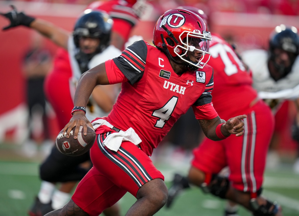(Bethany Baker  |  The Salt Lake Tribune) Utah Utes quarterback Devon Dampier (4) runs the ball during the first half of the game between the Utah Utes and the Idaho Vandals at Rice-Eccles Stadium in Salt Lake City on Thursday, Sept. 3, 2026.