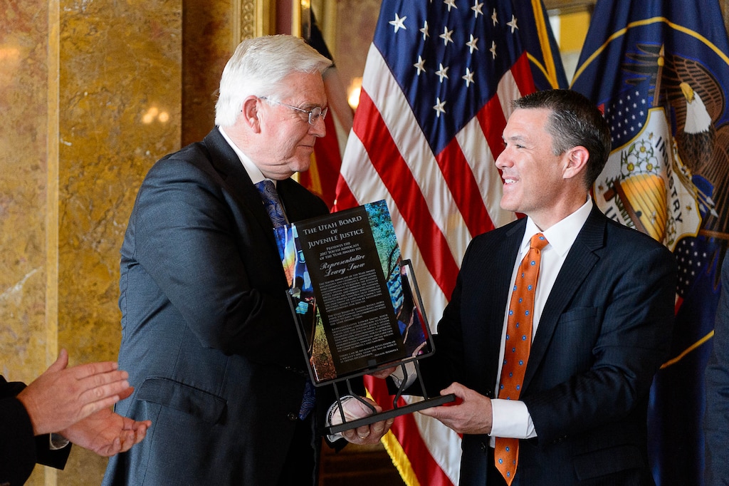 (Trent Nelson | The Salt Lake Tribune) Rep. Lowry Snow, R-St. George, receives an award naming him one of the Utah Board of Juvenile Justice Youth Advocates of the Year during a ceremony at the State Capitol Building in Salt Lake City, Thursday October 26, 2017. Presenting the award is Ron Gordon, Executive Director of the Utah Commission on Criminal and Juvenile Justice.