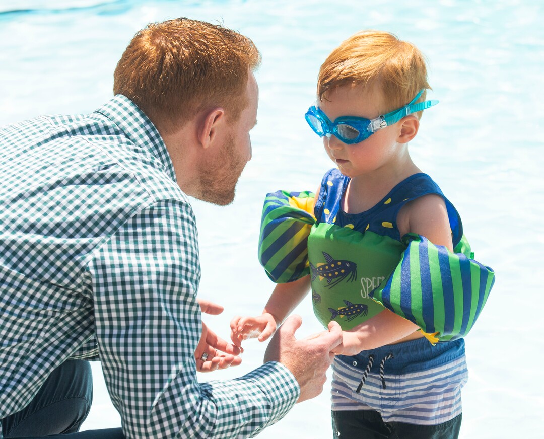 (Rick Egan  |  The Salt Lake Tribune)    Todd Miles talks to his 3-year-old son Nathan Miles, who nearly died in an accidental drowning incident in his grandmotherÕs pool, during a news conference at the Jewish Community Center  to promote summer water safety, Friday May 31, 2019