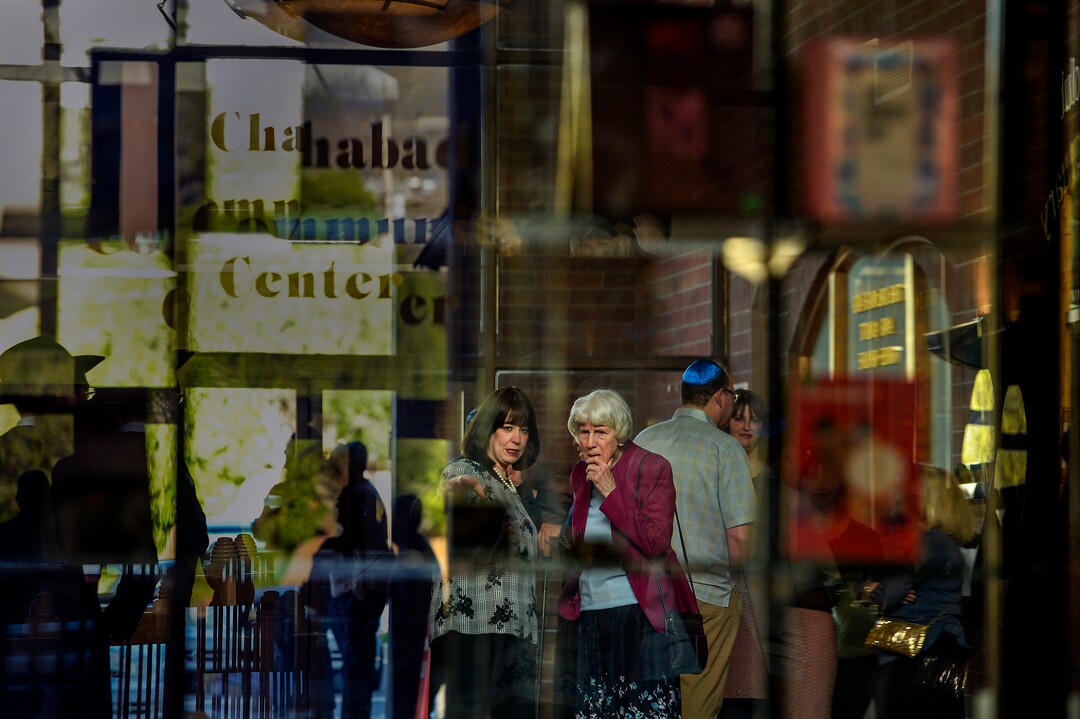 Leah Hogsten  |  The Salt Lake Tribune l-r Sharonne Zippel talks with Pamela Atkinson prior to the Shabbat candle lighting. Jewish women in Utah at the Chabad Lubavitch of Utah and the world over kindled Shabbat candles, May 3, 2019 in loving tribute to Lori Gilbert-Kaye and in prayer for peace and tolerance amongst all of humanity. Lori Kaye was killed during The Chabad of Poway synagogue shooting on the last day of Passover and three others were injured. Although the lighting of Shabbat Candles is uniquely tasked to the Jewish woman, the  community and those wishing to show their support were welcome to attend.