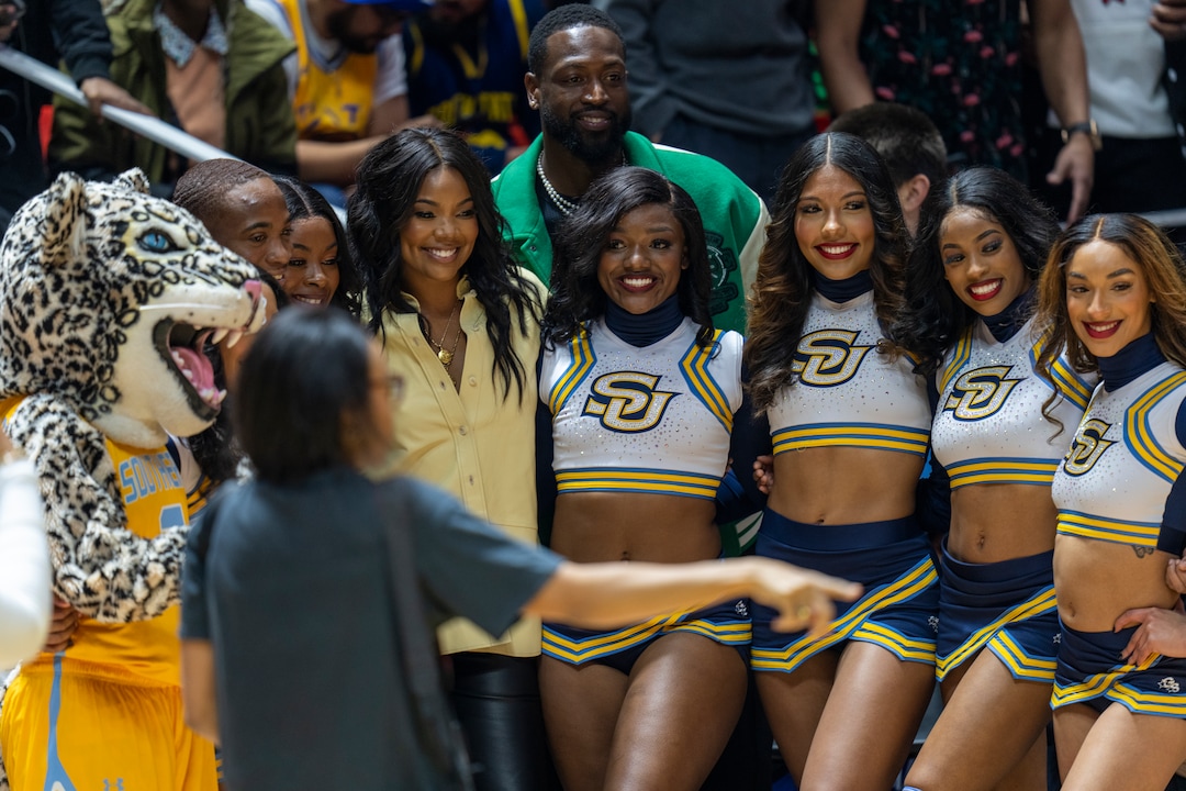 (Rick Egan | The Salt Lake Tribune)  Actress Gabrielle Union and husband Dwyane Wade pose for photos with the Southern University cheerleaders during the HBCU game at the Jon M. Huntsman Center, on Saturday, Feb. 18, 2023.