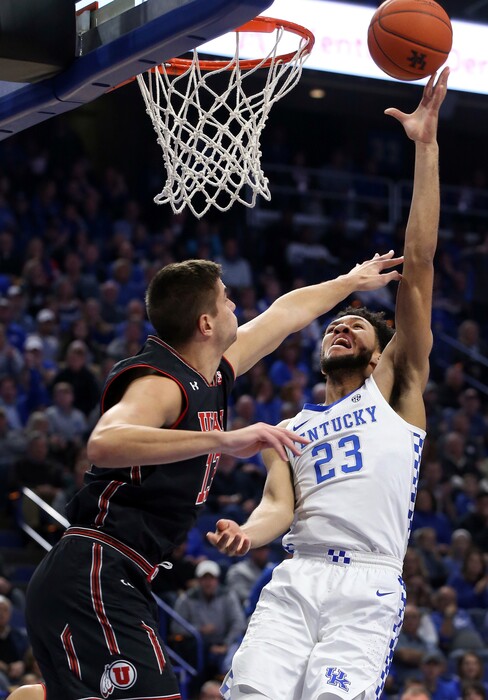 Kentucky's EJ Montgomery (23) shoots while defended by Utah's Novak Topalovic (13) during the first half of an NCAA college basketball game in Lexington, Ky., Saturday, Dec. 15, 2018. (AP Photo/James Crisp)