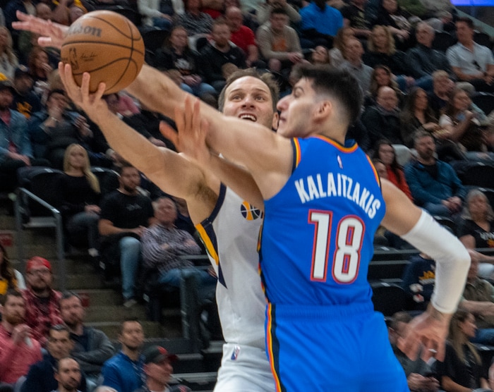 (Rick Egan | The Salt Lake Tribune) Utah Jazz forward Bojan Bogdanovic (44) shoots as Oklahoma City Thunder forward Georgios Kalaitzakis (18) defends, in NBA action between the Utah Jazz and the Oklahoma City Thunder at Vivint Arena, on Wednesday, April 6, 2022.
