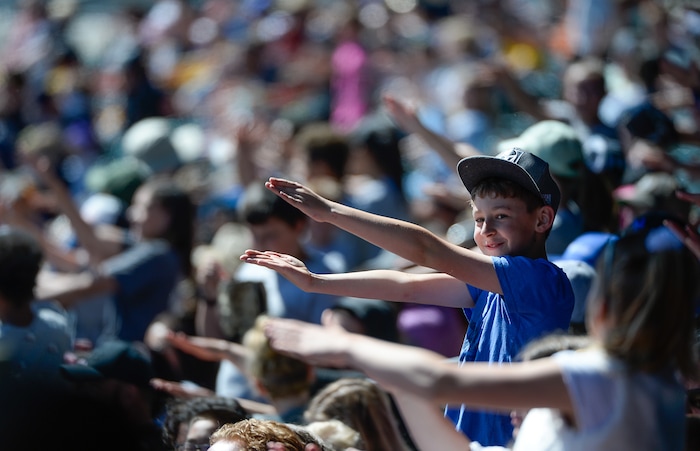 (Francisco Kjolseth  |  The Salt Lake Tribune)  Kids dance and sing to some of their favorite songs while gathered at Smith's Ballpark on Thursday, May 2, 2019 for the staging of their annual kids day baseball game.