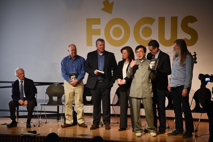 (Francisco Kjolseth | The Salt Lake Tribune) Jackie Chan, third from right, hands out copies of his book following a panel discussion on understanding environmental protection and sustaining a civilization through reuse and redesign at The Leonardo in Salt Lake on Thursday, Jan. 24, 2019. Included in the panel discussion, from left, were Nobel Laureate Mario R. Capecchi, Andy Noorda, Co-founder of Wholistic, David Bywater, CEO of Vivint Solar, Julie Kilgore, President of Wasatch Environmental, Shane McKenna, Inventor and Founder & CTO of Ascending Harvest and C. Arden Pope III, BYU Professor of Economics.