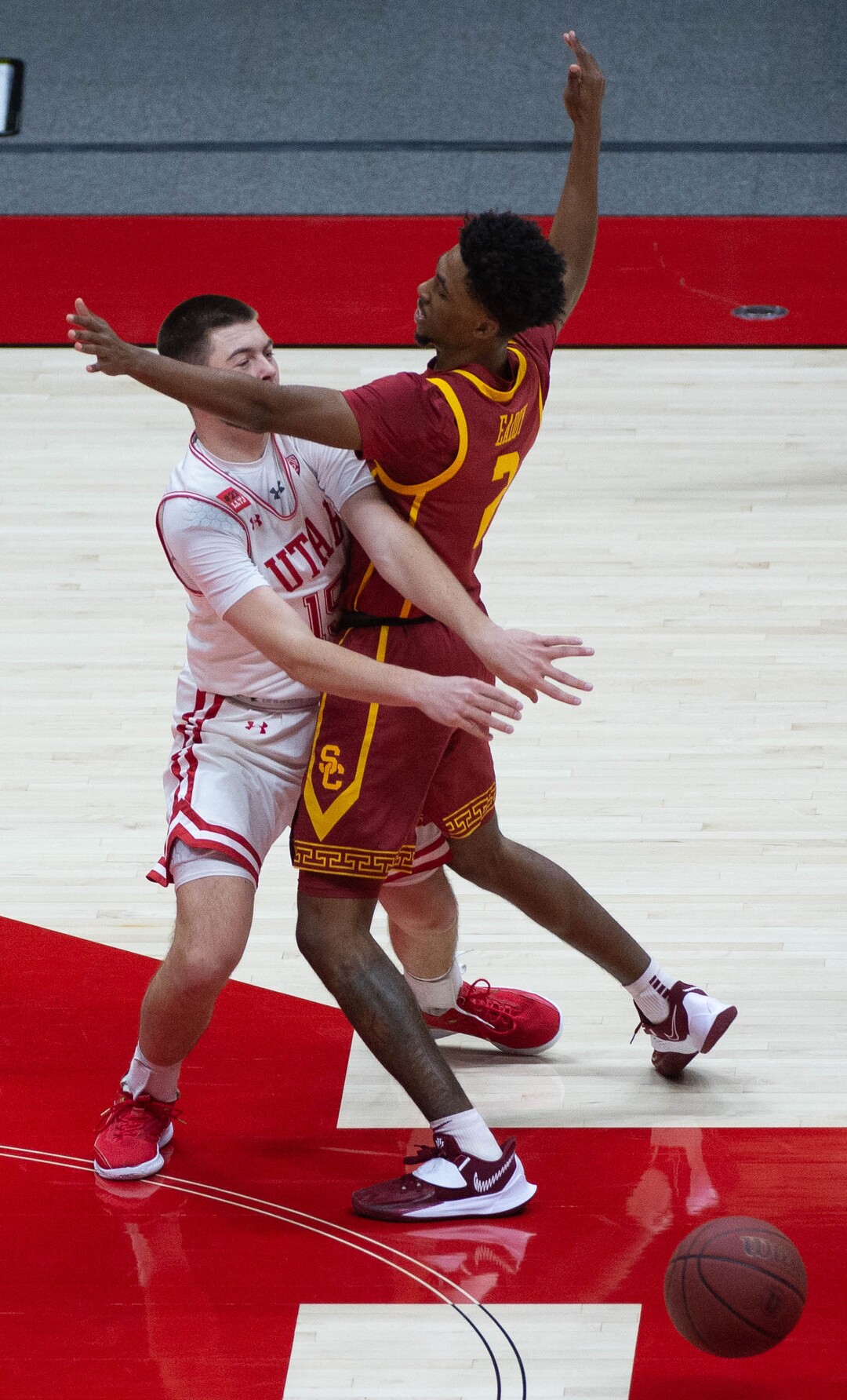(Francisco Kjolseth  | The Salt Lake Tribune) Utah Utes guard Rylan Jones (15) is blocked by USC Trojans guard Tahj Eaddy (2) in PAC-12 basketball action at the Jon M. Huntsman Center, on Saturday, Feb. 27, 2021.