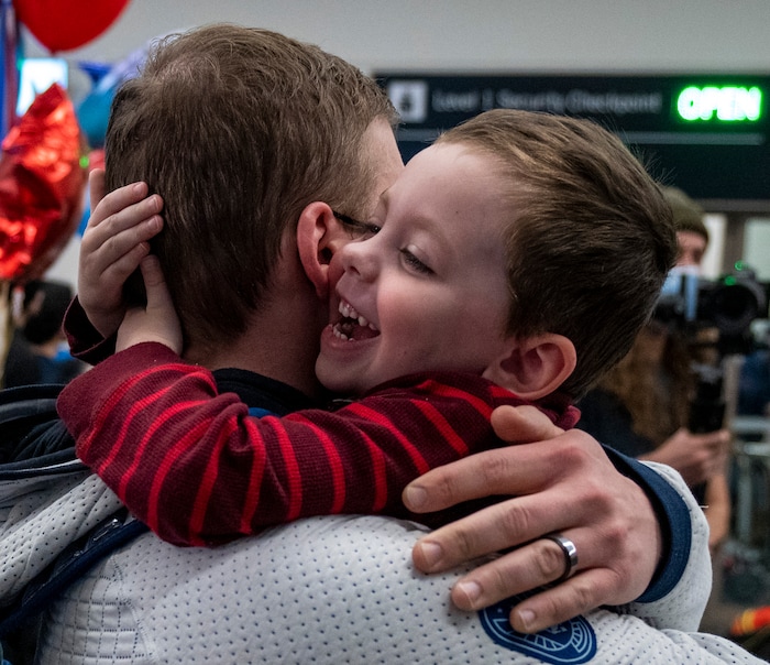 (Rick Egan | The Salt Lake Tribune) Four-year-old Thomas Stuart, welcomes home his dad Andrew Stuart, a conditioning coach for the U.S. speedskating team, as he and other Team USA Olympians arrive at the Salt Lake City International Airport on Monday, Feb. 21, 2022.