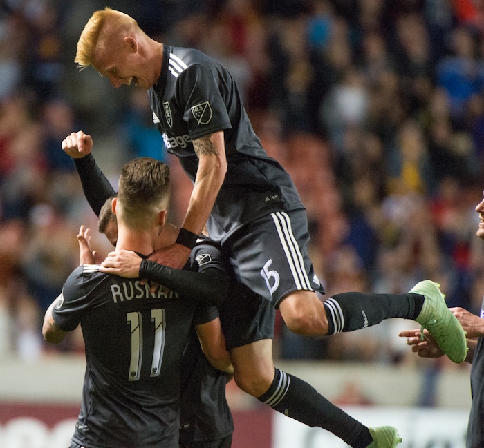 (Rick Egan  |  The Salt Lake Tribune)     Real Salt Lake forward Brooks Lennon (12) and Real Salt Lake defender Justen Glad (15) celebrate the goal by Real Salt Lake midfielder Albert Rusnak (11) late in the game, in MLS soccer action, between Real Salt Lake and Colorado Rapids,  at Rio Tinto Stadium, Saturday, April 21, 2018.


