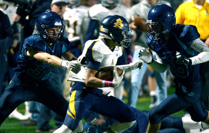 (Leah Hogsten | The Salt Lake Tribune) Juan Diego's Austin Gillespie takes down Summit Academy's Gavin Davey. Summit Academy boys' football team leads Juan Diego High School 51-43 during their game, October 13, 2017 in Draper.