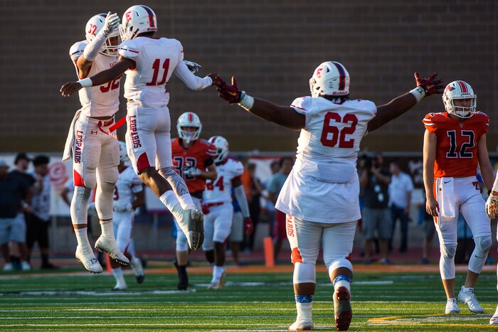 (Chris Detrick  |  The Salt Lake Tribune)  East's Andre Toilolo (32) East's Jadin Afuvai (11) and East's Apu Ika (62) celebrate after Toilolo sacked Timpview's Jake Biggs (1) during the game at Timpview High School Thursday, August 17, 2017. 