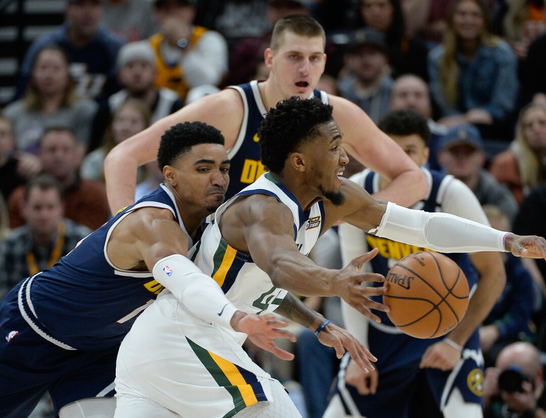 (Francisco Kjolseth  |  The Salt Lake Tribune) Denver Nuggets guard Gary Harris (14) pressures Utah Jazz guard Donovan Mitchell (45) as the Utah Jazz host the Denver Nuggets in their NBA basketball game at Vivint Smart Home Arena in Salt Lake City on Wednesday, Feb. 5, 2020.