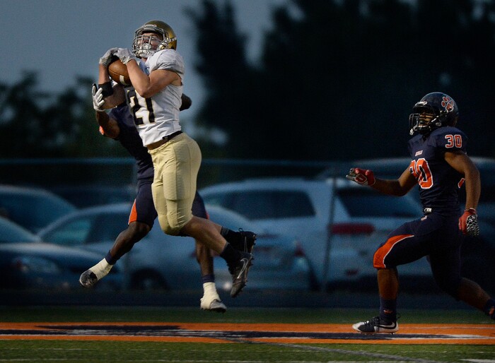 (Scott Sommerdorf   |  The Salt Lake Tribune)   
Skyline's Taylor Larsen catches a TD pass in the waning minutes of the first half to give Skyline a 14-10 lead at the half over Brighton, Friday, September 15, 2017.