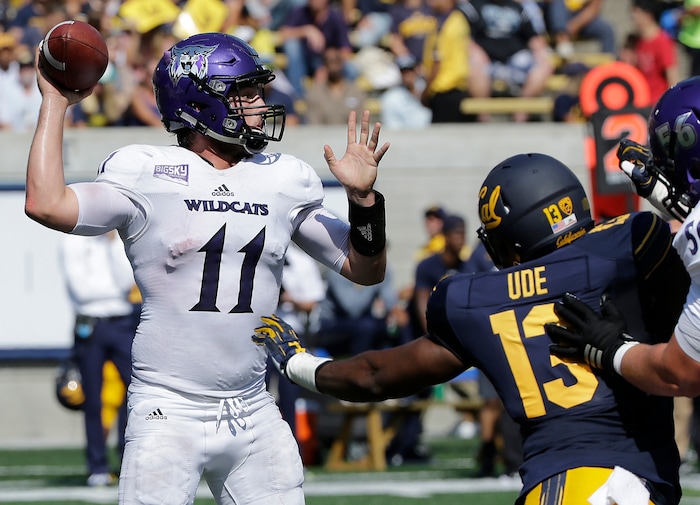 Weber State quarterback Stefan Cantwell (11) passes as California defensive end Russell Ude (13) applies pressure during the first half of an NCAA college football game in Berkeley, Calif., Saturday, Sept. 9, 2017. (AP Photo/Jeff Chiu)