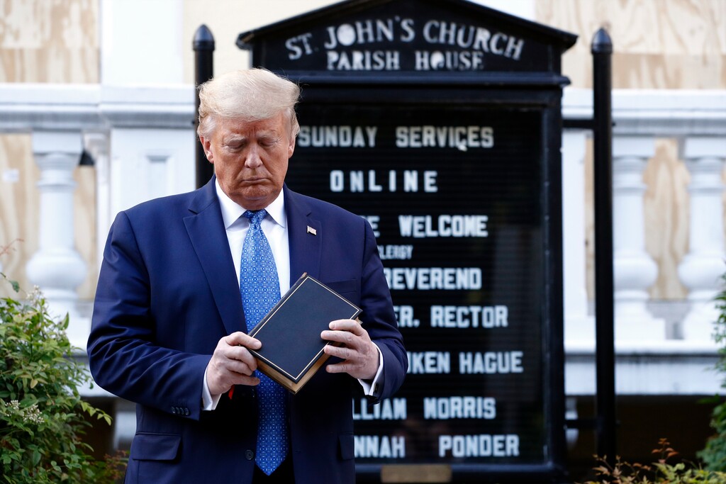 FILE - In this June 1, 2020, file photo, President Donald Trump holds a Bible as he visits outside St. John's Church across Lafayette Park from the White House in Washington. Trump began June with his Bible-clutching photo op outside the church after authorities used chemicals and batons to scatter peaceful demonstrators, and the month never got less jarring or divisive. Now, some Republicans are expressing concern about the month's impact on their party's ability to hold the Senate. (AP Photo/Patrick Semansky, File)