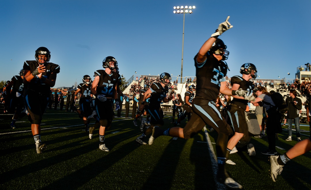 Leah Hogsten  |  The Salt Lake Tribune  West Jordan High School football takes the field as they host Riverton High School, Thursday, Sept. 13, 2018 in West Jordan. 