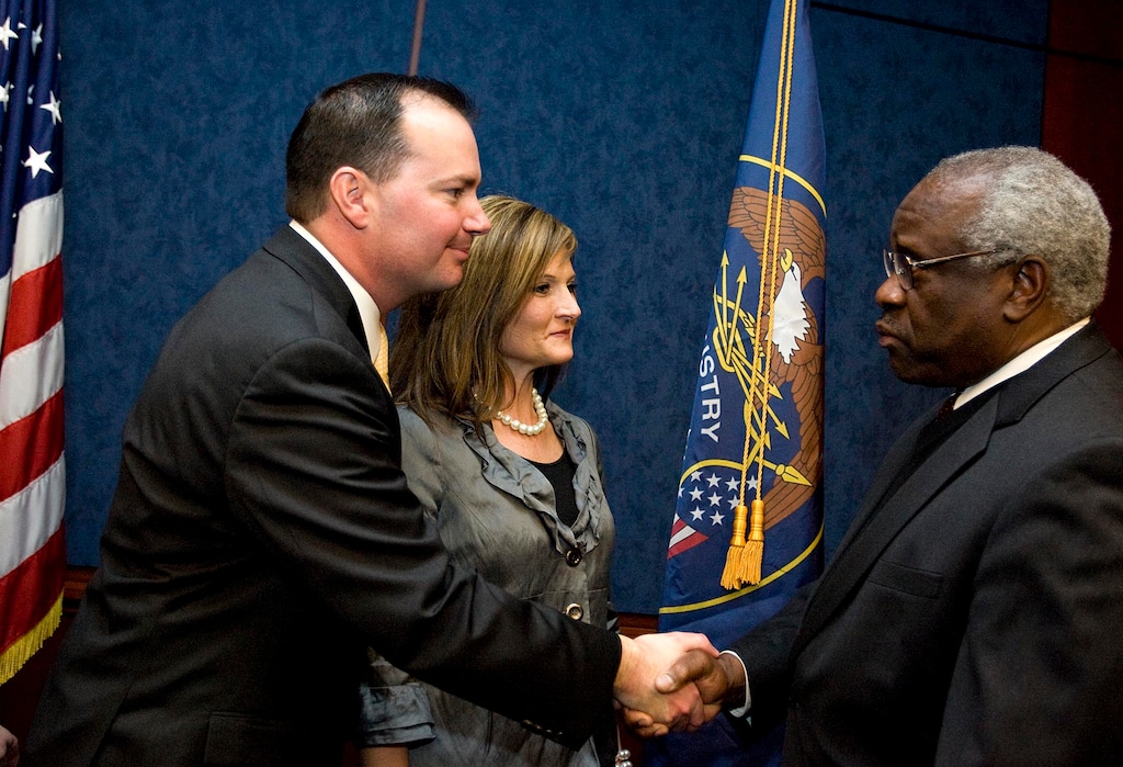 (Djamila Grossman | The Salt Lake Tribune) Sen. Mike Lee, left, and his wife, Sharon, talk to Supreme Court Justice Clarence Thomas during a gathering with friends, family, and other public officials after Lee was sworn in as a senator on Capitol Hill in Washington, Wednesday, Jan. 5, 2011.