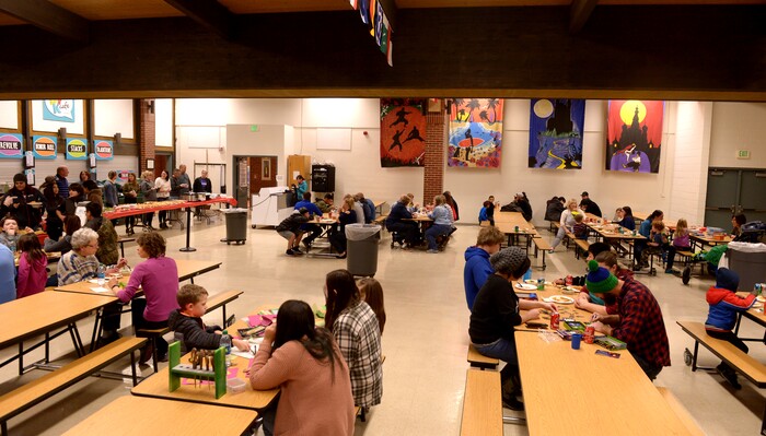(Leah Hogsten  |  The Salt Lake Tribune) Sixteen members of Granite Park Junior High School’s faculty prepared and served a hot spaghetti meal to students and their families, Friday, December 22, 2017 at the school for the inaugural ‘Dinner at the Park.' Roughly 90 percent of students who attend Granite Park Junior High in South Salt Lake qualify for free or reduced lunch through the federal school lunch program. Knowing the challenges faced by their students, staff members at Granite Park came up with an idea to help families through the holidays.
