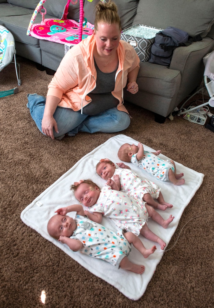 (Rick Egan  |  The Salt Lake Tribune)       Kayla Glines, with her quadruplets, Reese, Lincoln, Oaklee Jamesen at her home in Ogden, Saturday, June 15, 2019.