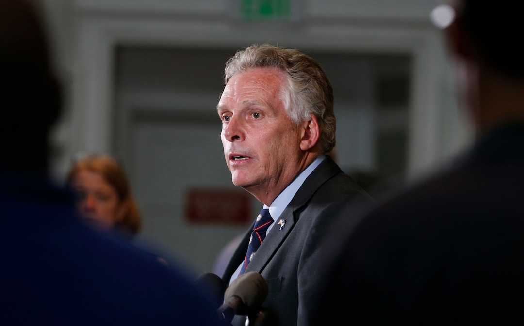 Virginia Gov. Terry McAuliffe addresses a news conference concerning the white nationalist rally and violence in Charlottesville, Va., Saturday, Aug. 12, 2017. (AP Photo/Steve Helber)
