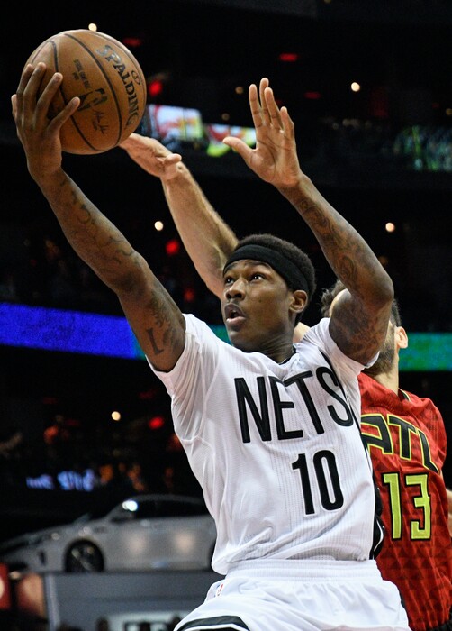 Brooklyn Nets guard Archie Goodwin (10) shoots as Atlanta Hawks guard Jose Calderon defends during the first half of an NBA basketball game, Sunday, March 26, 2017, in Atlanta. (AP Photo/John Amis)