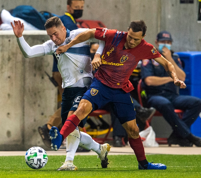 (Rick Egan  |  The Salt Lake Tribune)   Real Salt Lake defender Donny Toia (4) brings the ball down field as Vancouver Whitecaps defender Jake Nerwinski (28) defends, in MLS soccer action between Real Salt Lake and the Vancouver Whitecaps at Rio Tinto Stadium on Saturday, Sept. 19, 2020.

 