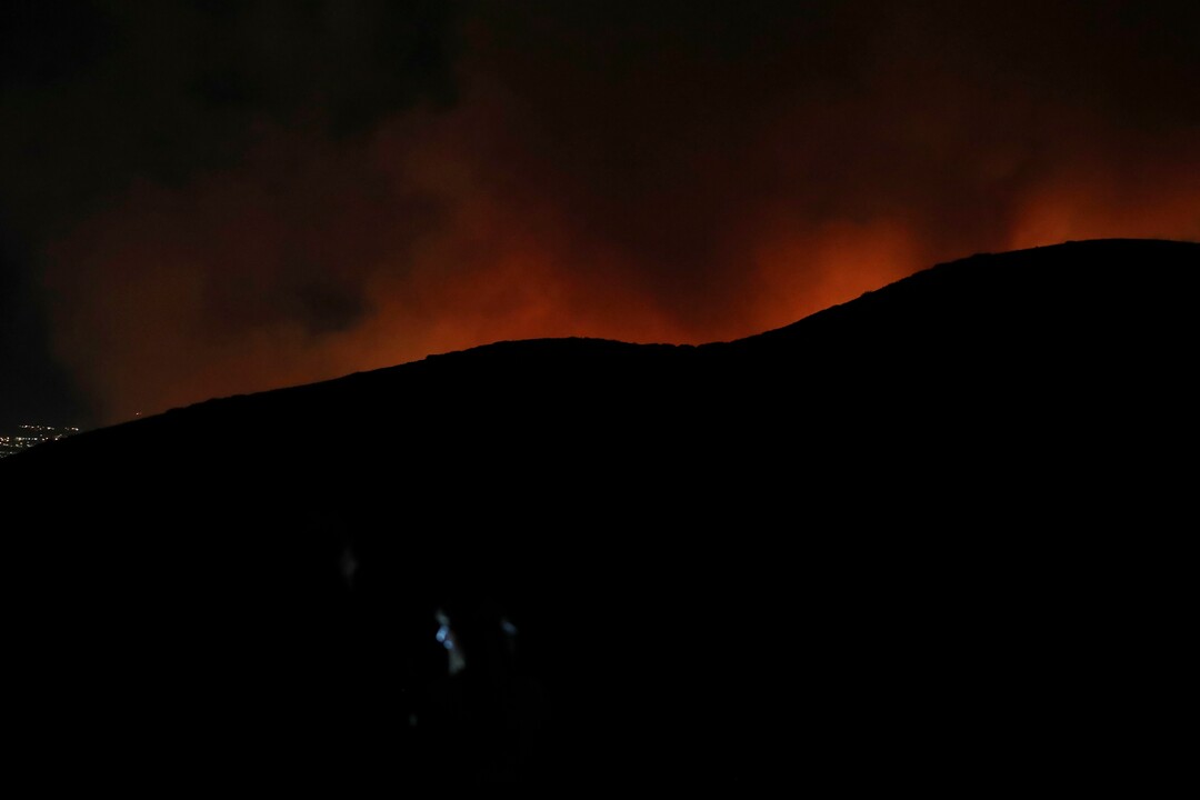 (George Frey  |  for The Salt Lake Tribune) A wildfire burns on Traverse Mountain above Lehi, Uta,h on June 28th, 2020.