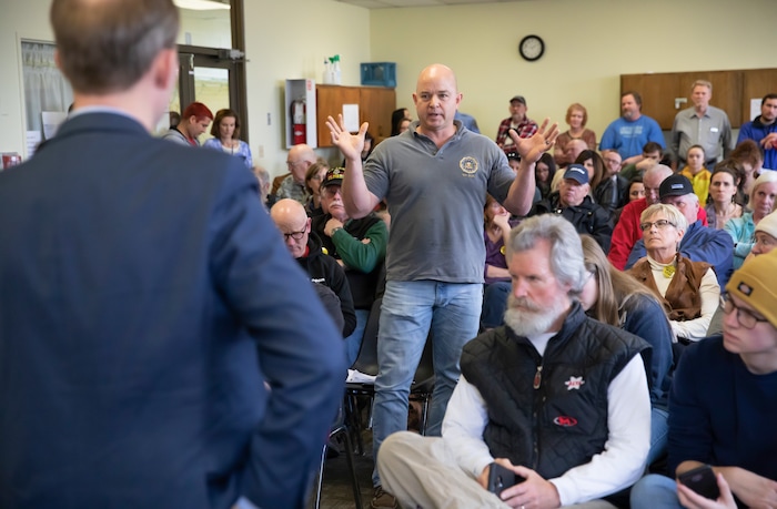 (Keith Johnson  |  for The Salt Lake Tribune) Newly elected Utah Congressman Ben McAdams, representing Utah's 4th District (left), listens to Stephen Olsen, a 20 year FBI agent and furloughed federal employee, during a town hall meeting held by McAdams at the Redwood Recreational Center in West Valley City, Utah on Jan. 19, 2019. McAdams held the town hall meeting to make good on a promise to be more accessible to constituents, a criticism he leveled against former congresswoman Mia Love during McAdam's campaign. 