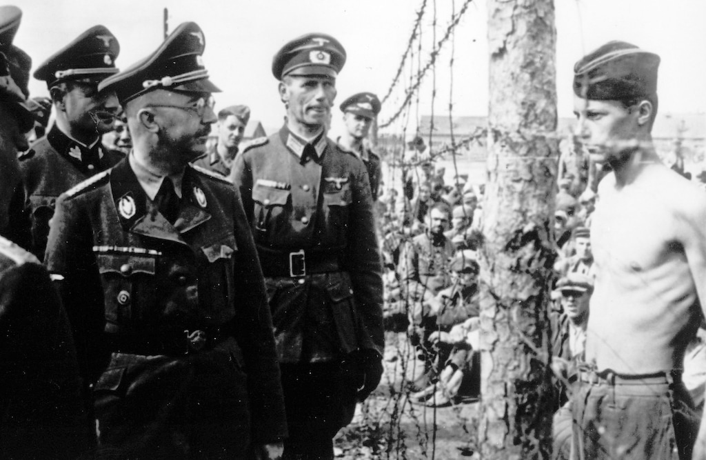 This undated photograph shows the head of the Nazi German SS and Gestapo, Heinrich Himmler, as he inspects a German prisoner of war camp at an unknown location in the Soviet Union. (AP Photo)