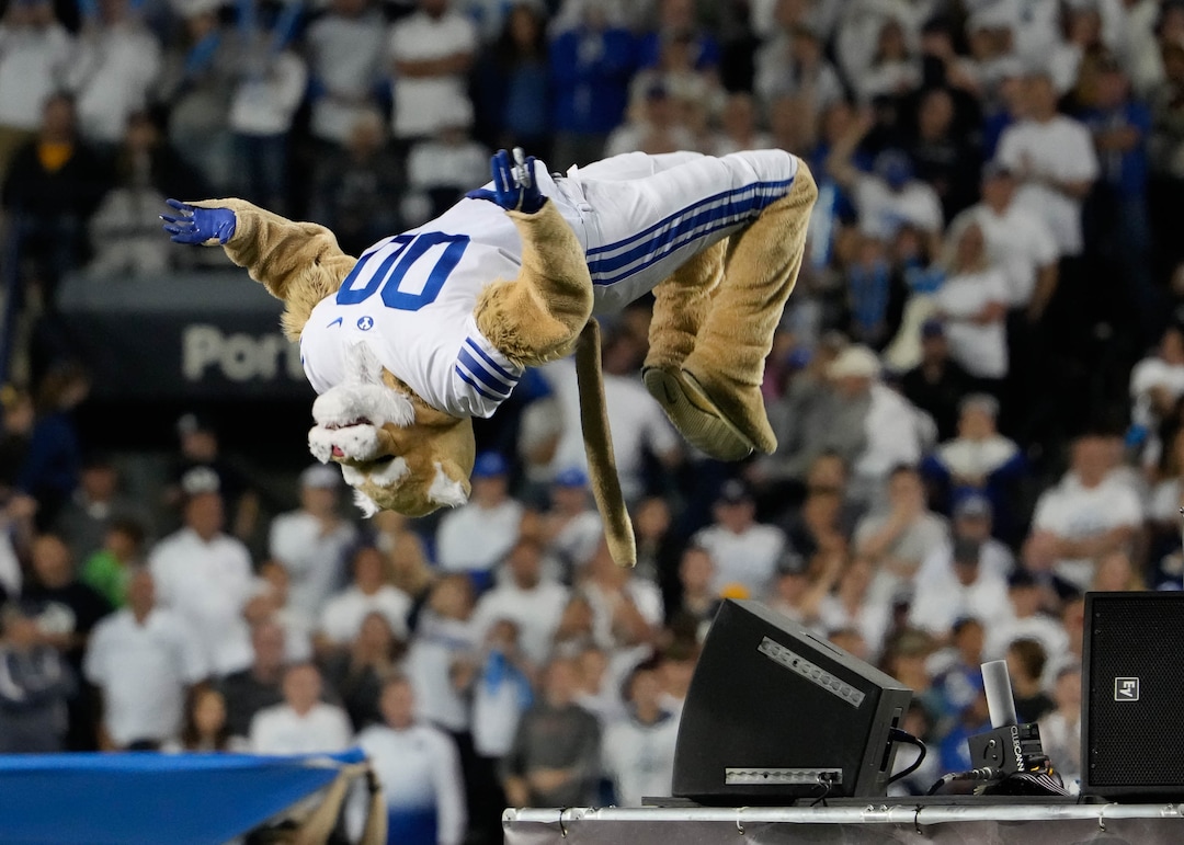 (Francisco Kjolseth | The Salt Lake Tribune) Cosmo shows off his athleticism as Brigham Young Cougar fans cheer on their team against the Arizona State Sun Devils at LaVell Edwards Stadium in Provo, on Saturday, Sept. 18, 2021.