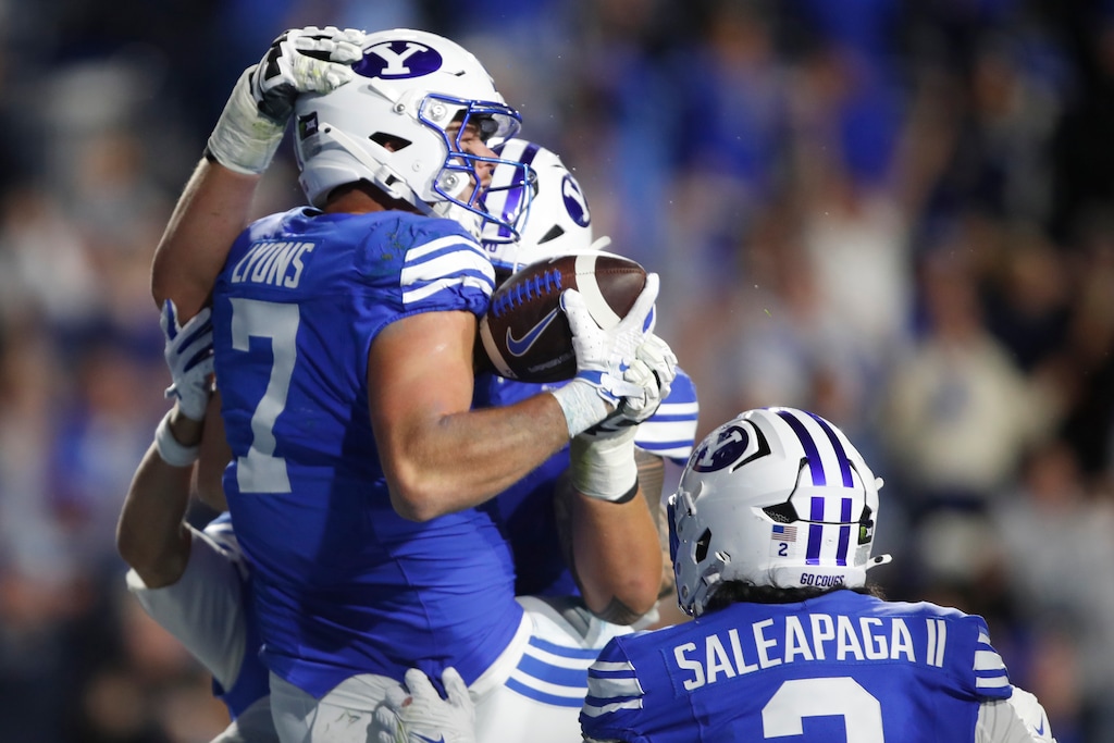(George Frey | Special to The Tribune) BYU Cougars tight end Walker Lyons (7) celebrates his game-winning touchdown with his teammates during a game against Notre Dame Fighting Irish at LaVell Edwards Stadium on October 17, 2026.