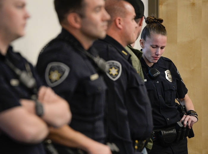 (Francisco Kjolseth  |  The Salt Lake Tribune)  Kaysville officer Lacy Turner expresses her emotions as the surveillance video of a suicidal subject call on April 5, 2018, that injured her and three other officers is played for the media on Thursday, April 12, 2018. The officers responded to a man who entered a Chevron gas station store and doused himself with gasoline. As the officers tried to get a lighter from the manÕs hand, the man lit himself on fire.