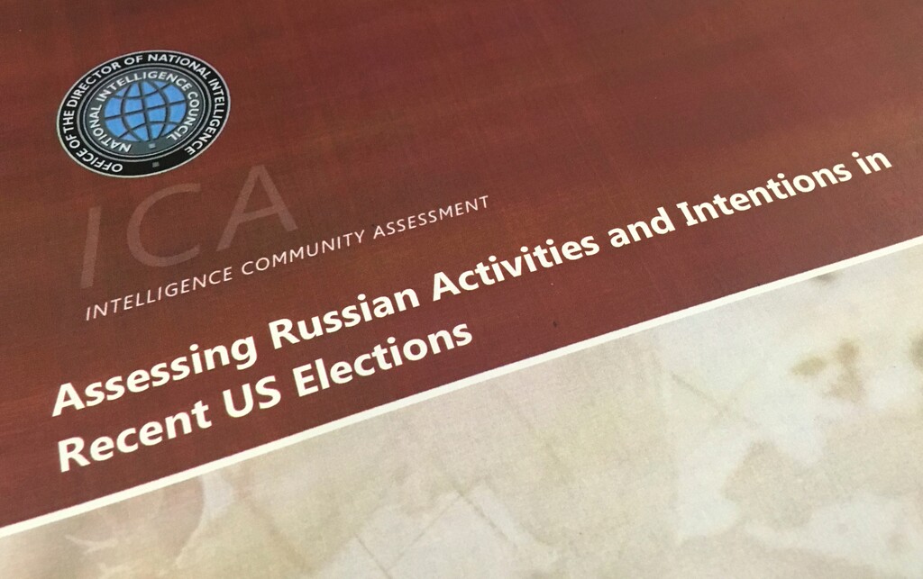 A part of the declassified version Intelligence Community Assessment on Russia's efforts to interfere with the U.S. political process is photographed in Washington, Friday, Jan. 6, 2017. Russian President Vladimir Putin ordered a campaign to influence the American presidential election in favor of electing Donald Trump, according to the report issued by U.S. intelligence agencies. The unclassified version was the most detailed public account to date of Russian efforts to interfere with the U.S. political process, with actions that included hacking into the email accounts of the Democratic National Committee and individual Democrats like Hillary Clinton's campaign chairman John Podesta. (AP Photo/Jon Elswick)