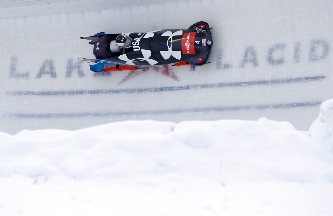 United States' Steven Holcomb pilots with brakeman Jesse Beckom during a training run for the two-man bobsled World Cup competition on Thursday, Dec. 12, 2013, in Lake Placid, N.Y. Competition starts on Friday. (AP Photo/Mike Groll)
