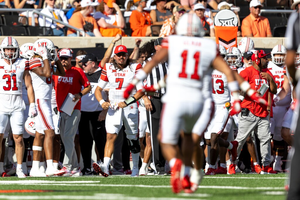 Utah quarterback Cameron Rising (7) celebrates on the sidelines in the first half of an NCAA college football game against Oklahoma State Saturday, Sept. 21, 2024, in Stillwater, Okla. (AP Photo/Mitch Alcala)