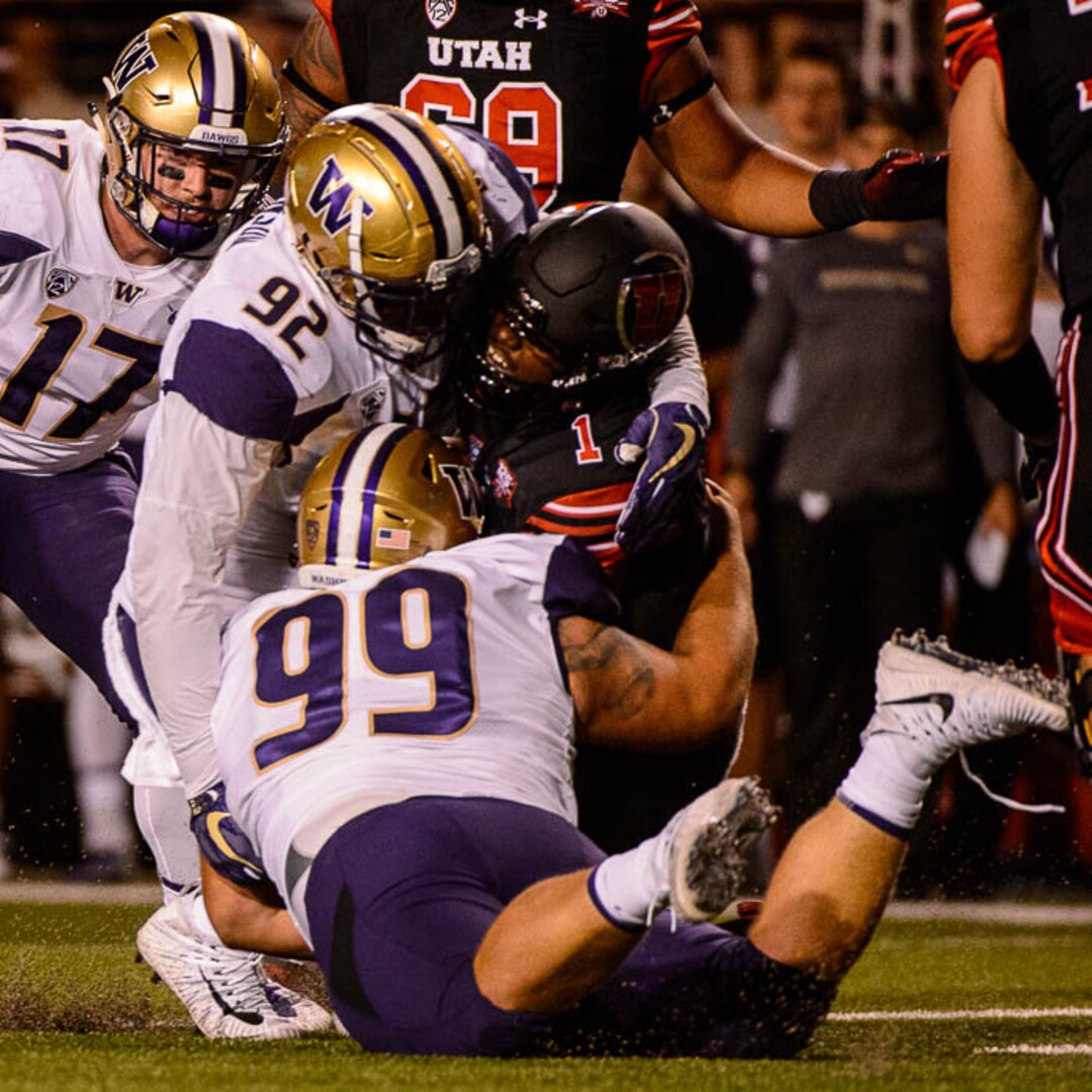 (Trent Nelson | The Salt Lake Tribune)  Utah Utes quarterback Tyler Huntley (1) is tackled as the University of Utah hosts Washington at Rice-Eccles Stadium in Salt Lake City, Saturday Sept. 15, 2018.