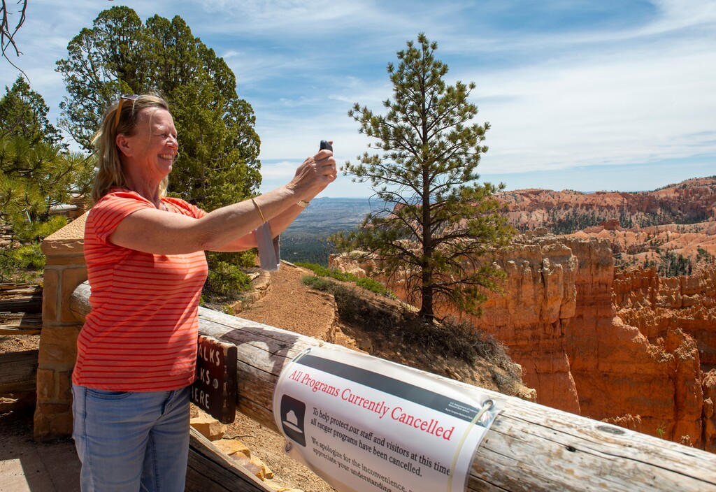 (Rick Egan  |  The Salt Lake Tribune)    Alese Rhodes from Tri-cities, Washington takes photo at Sunset Point, at Bryce Canyon National Park, Wednesday May 6, 2020. A new study shows Bryce Canyon has the second-most Instagram posts per square mile, behind only Gateway Arch in Missouri.