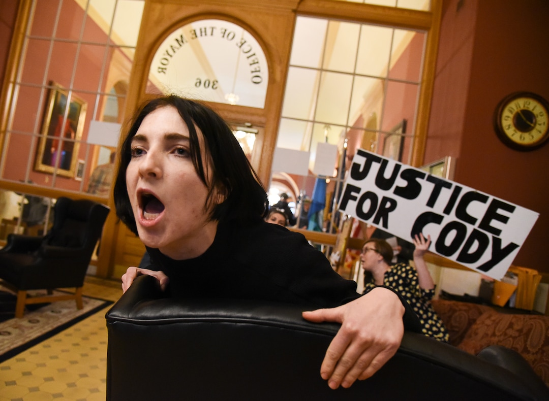 (Francisco Kjolseth  |  The Salt Lake Tribune)  Carly Haldeman chants "no justice no peace" as she and a dozen or so others friends of Cody Belgard, organize a sit-in at the office of Mayor Jackie Biskupski in Salt Lake City on Thursday, Jan. 10, 2019, to demand a meeting with the mayor. The group along with members of Utah Against Police Brutality have tried for weeks to get a meeting to discuss the killing of Belgard by Salt Lake City police last November.