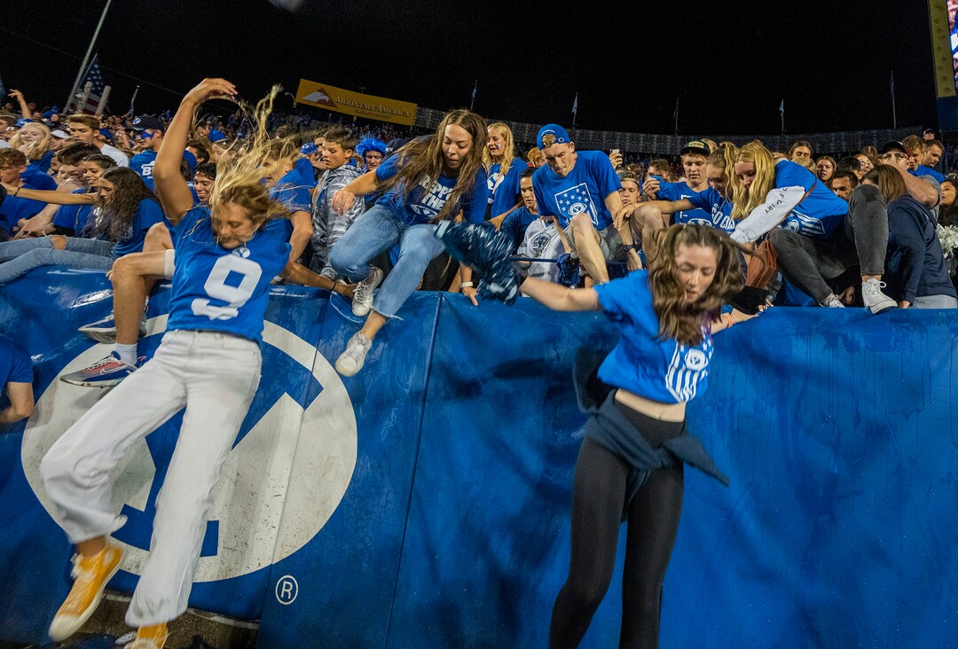 (Rick Egan | The Salt Lake Tribune) BYU fans storm the field as the Brigham Young Cougars defeat the Utah Utes 26-17, at Lavell Edwards Stadium in Provo, on Saturday, Sept. 11, 2021.
