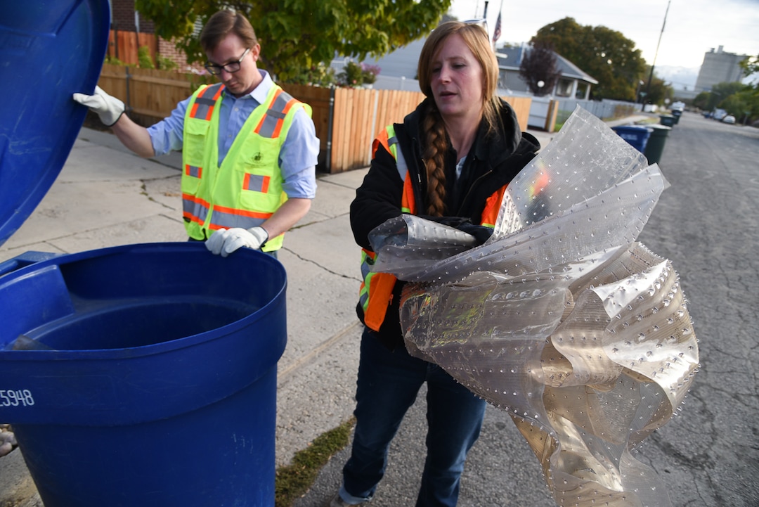 (Francisco Kjolseth  |  The Salt Lake Tribune)  Jen Farrell, lead outreach and education specialist for Salt Lake City Corporation Sanitation Division and permits coordinator David Johnston remove office flooring plastic that cannot be recycled. The recycling education team issue an average of 150 tags per week as they educate the public on what can be recycled.  