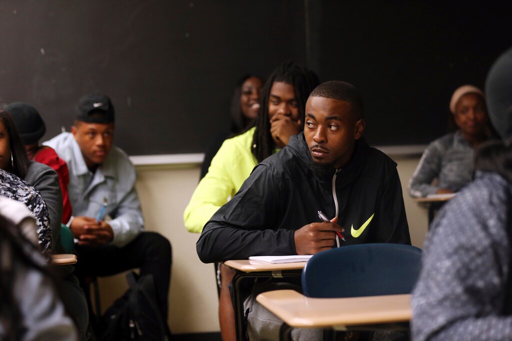 In this Monday, Nov. 13, 2017 photo, Devante Kincade, quarterback for the Grambling's NCAA college football game college football team, listens during a criminal justice class at the university in Grambling, La. Kincade, who played two seasons at Mississippi , says playing football at a Historically Black College or University is an experience to savor. Playing at an HBCU is not just about entertaining halftime shows the schools are known for, it's about community.  (AP Photo/Gerald Herbert)