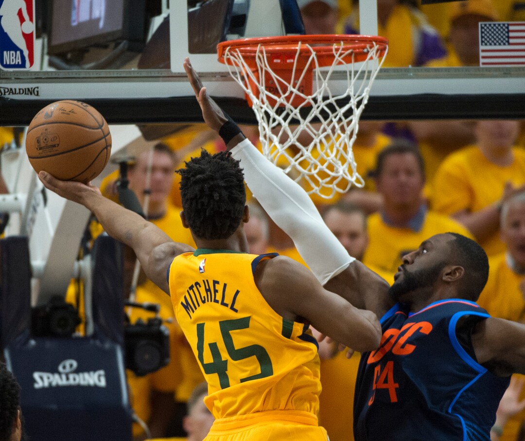 (Rick Egan  |  The Salt Lake Tribune)     Utah Jazz guard Donovan Mitchell (45) scores over Oklahoma City Thunder forward Patrick Patterson (54) at the end of the second quarter, in playoff action in game 6, between Utah Jazz and Oklahoma City Thunder in Salt Lake City, Friday, April 27, 2018.
