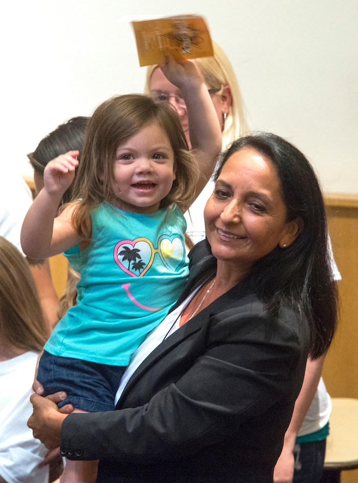 (Rick Egan  |  The Salt Lake Tribune)  Rosie Rivera holds her 3-year-old niece, Mia James, Saturday, Aug. 12, 2017, after giving her speech before the final vote for Salt Lake County sheriff. Democrats picked her to be the first woman to lead the office.