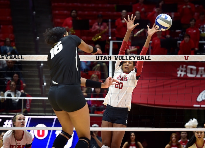(Scott Sommerdorf   |  The Salt Lake Tribune)   Utah's Tawnee Luafalemana looks to block a shot by Purdue's Sherridan Atkinson during second set play. Utah beat Purdue three sets to one in the second round of the NCAA volleyball tournament, Friday, December 1, 2017.  